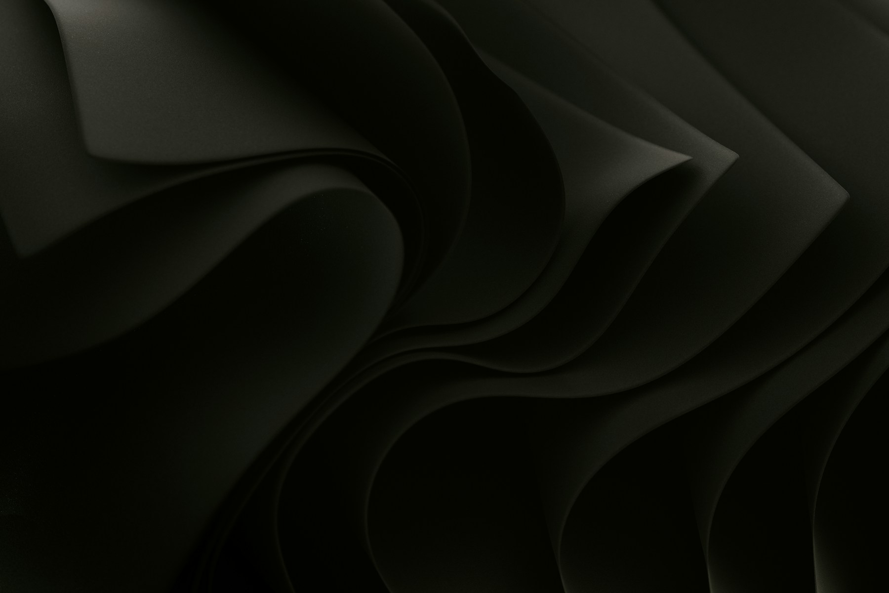 Abstract dark wavy paper folds with shadows